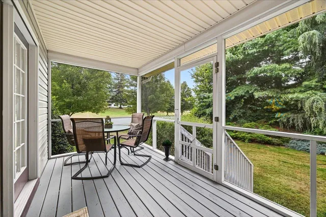a view of a two chairs in the balcony