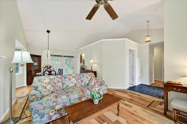 a bed room with a bed mirror and a night stand