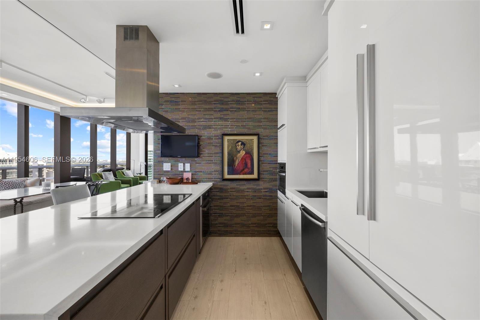 5875 Collins Avenue, Unit PH7 Miami Beach, FL 33140 - Photo 18 of 49 a large kitchen with stainless steel appliances granite countertop a lot of counter space