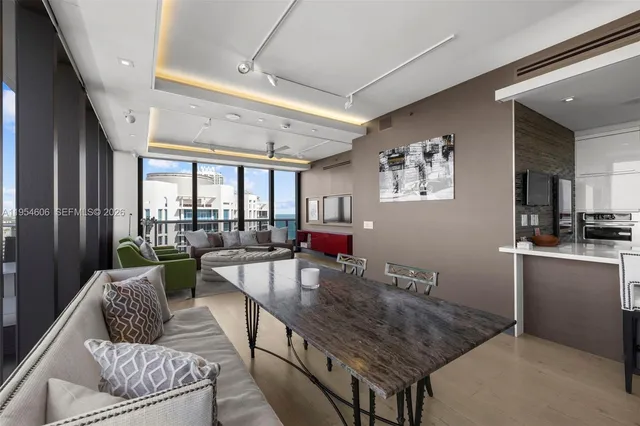 a living room with furniture and a table