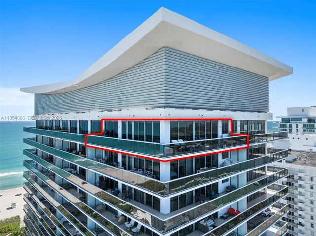 a front view of a house with balcony and staircase