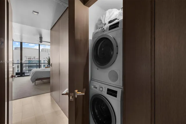 a view of a hallway with washer and dryer