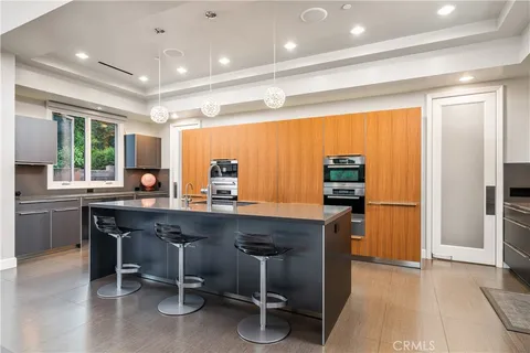 a spacious bedroom with a large bed and a large window