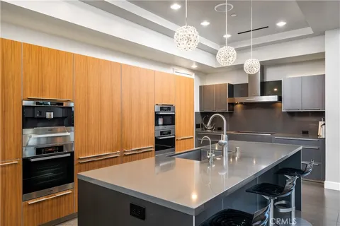 a bathroom with a double vanity sink mirror and shower