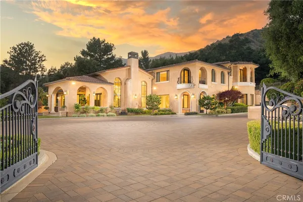 a view of a brick house with a outdoor space