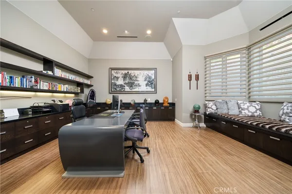 a large bathroom with a large tub a sink and large window