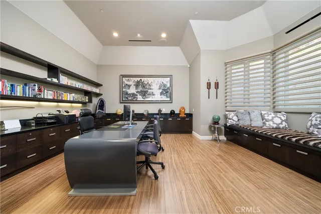 a large bathroom with a large tub a sink and large window