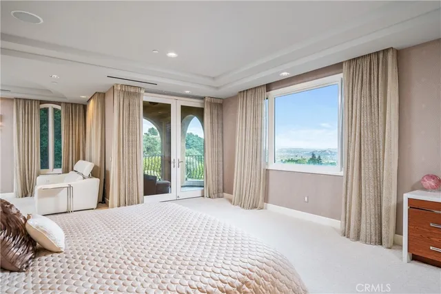 a bathroom with a sink a toilet a mirror and shower