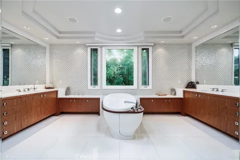 a view of a swimming pool with an outdoor seating and trees