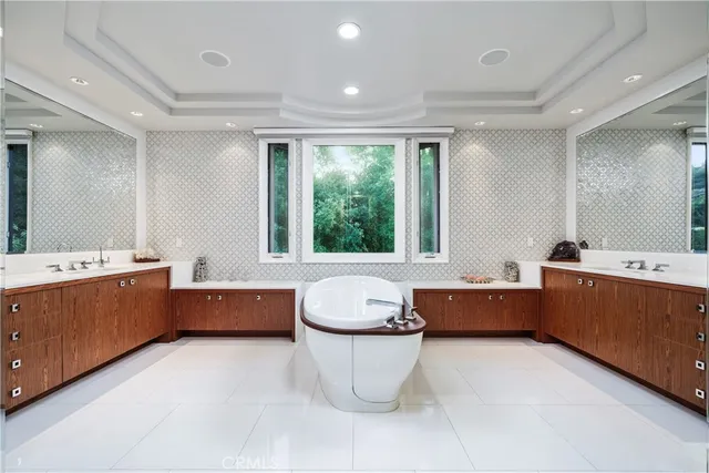 a view of a swimming pool with an outdoor seating and trees