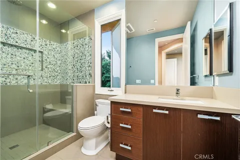 a front view of a house with a garden and porch