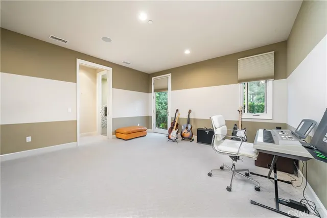 a front view of a house with swimming pool having outdoor seating