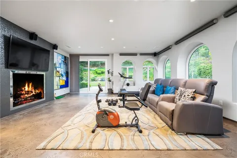 an aerial view of a house with a swimming pool