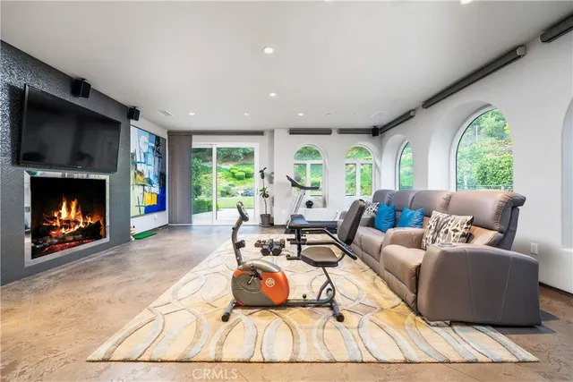 an aerial view of a house with a swimming pool