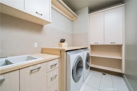an aerial view of a house with a garden and swimming pool