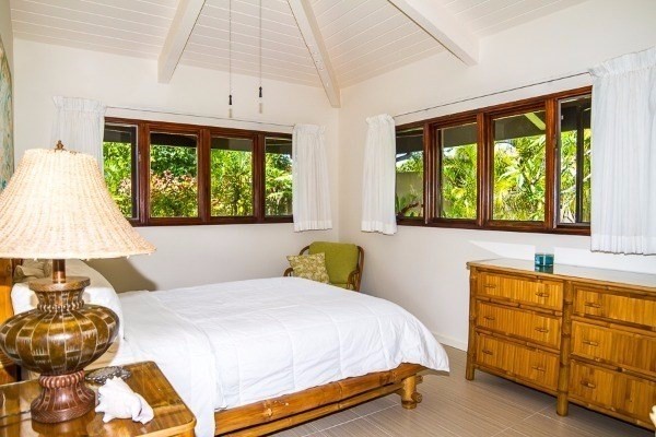 4200 Omao Road Koloa, HI 96756 - Photo 15 of 19 a bedroom with a bed and a window