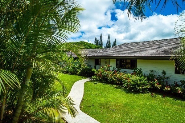 4200 Omao Road Koloa, HI 96756 - Photo 2 of 19 a view of a garden with a fountain