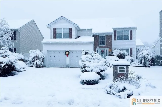 a front view of a house with white doors