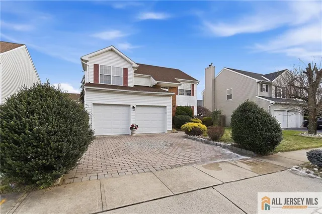 a room with furniture a chandelier and a window