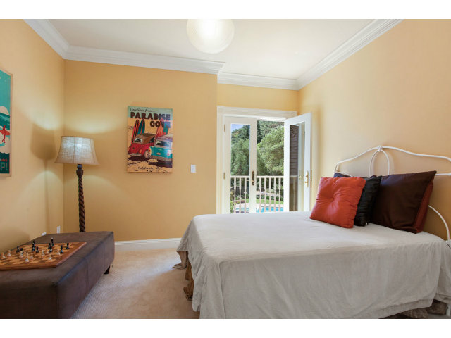 29551 Palomares Road Castro Valley, CA 94552 - Photo 19 of 25 a bedroom with a bed and a painting on the wall