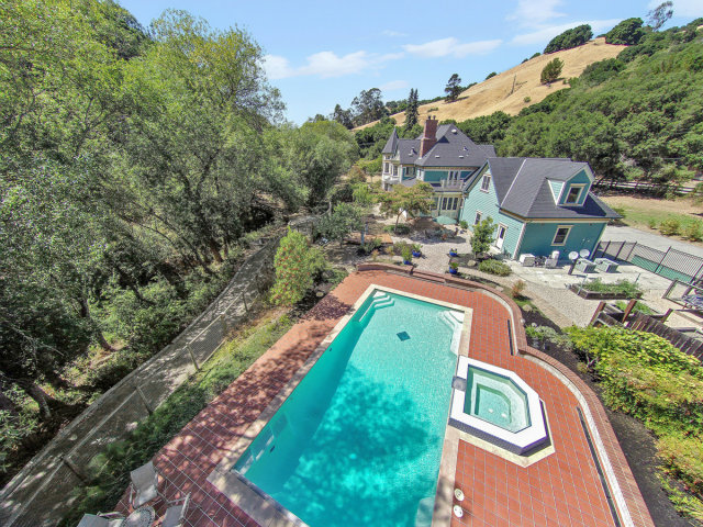 29551 Palomares Road Castro Valley, CA 94552 - Photo 2 of 25 a view of a swimming pool with a yard and plants