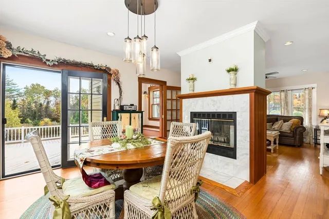 a living room with furniture a chandelier and a table