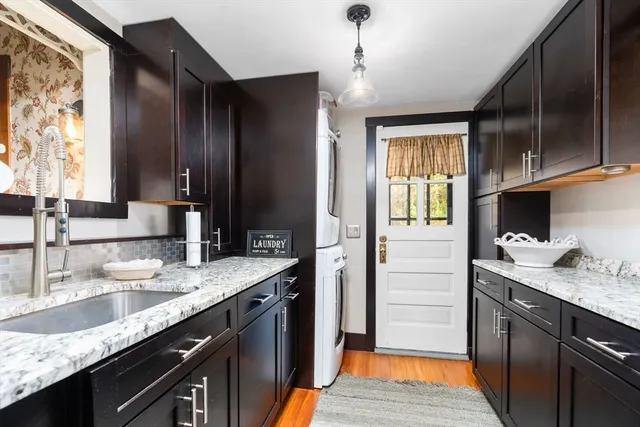 a backyard of a house with a large tree