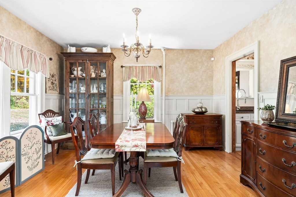 840 Fisher Road Fitchburg, MA 01420 - Photo 22 of 42 a living room with furniture a chandelier and a table