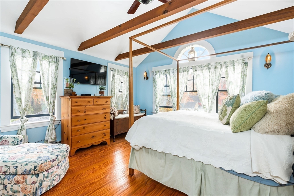 840 Fisher Road Fitchburg, MA 01420 - Photo 28 of 42 a bedroom with a bed and wooden floor