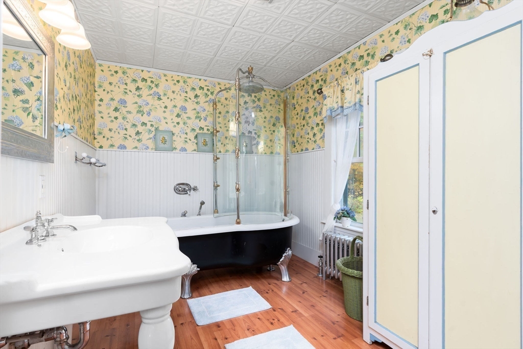 840 Fisher Road Fitchburg, MA 01420 - Photo 31 of 42 a bathroom with a sink a mirror and a shower