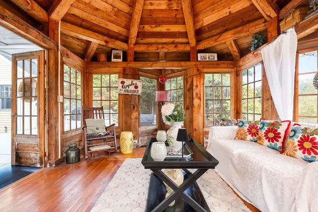a living room with furniture flat screen tv and a fireplace