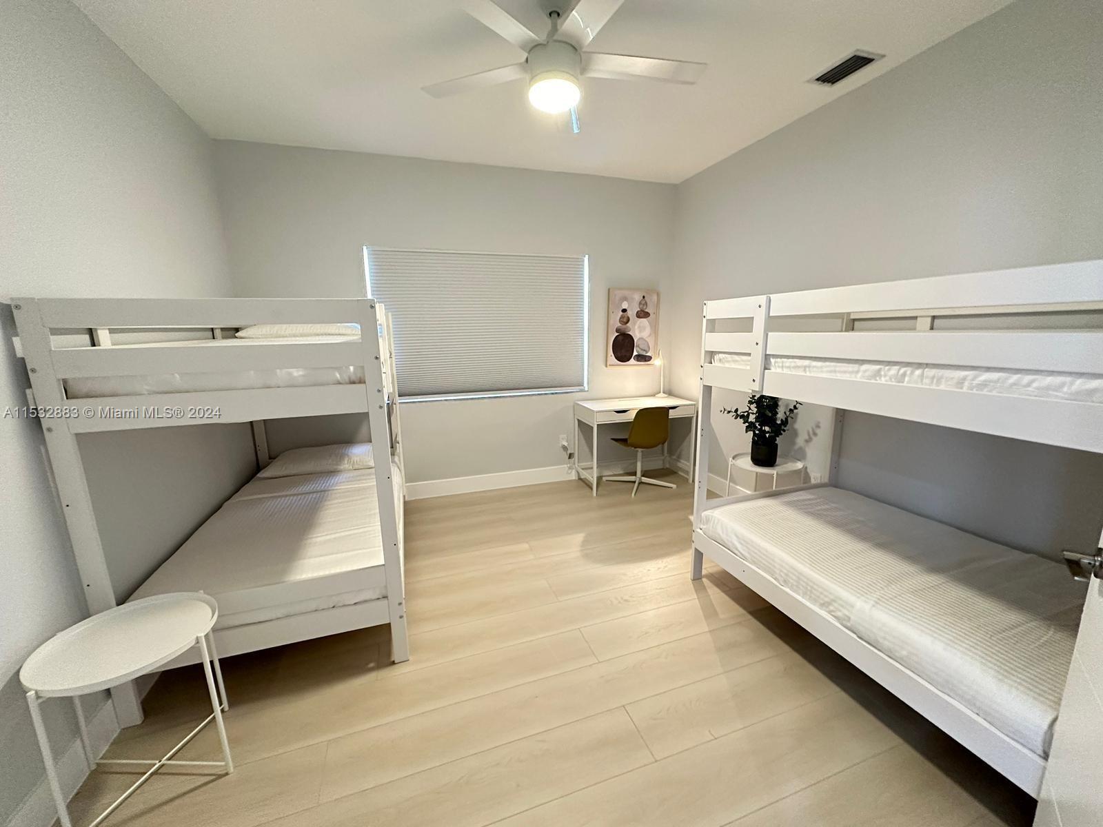 994 Northwest 2nd Street Miami, FL 33128 - Photo 20 of 30 a living room with furniture and a fireplace