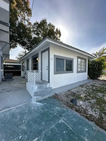 a view of a house with a yard and garage