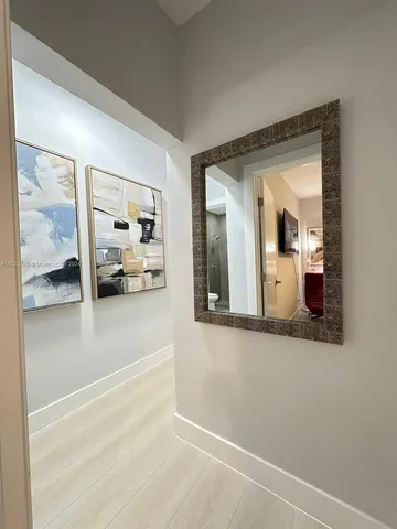 a view of a living room and bathroom