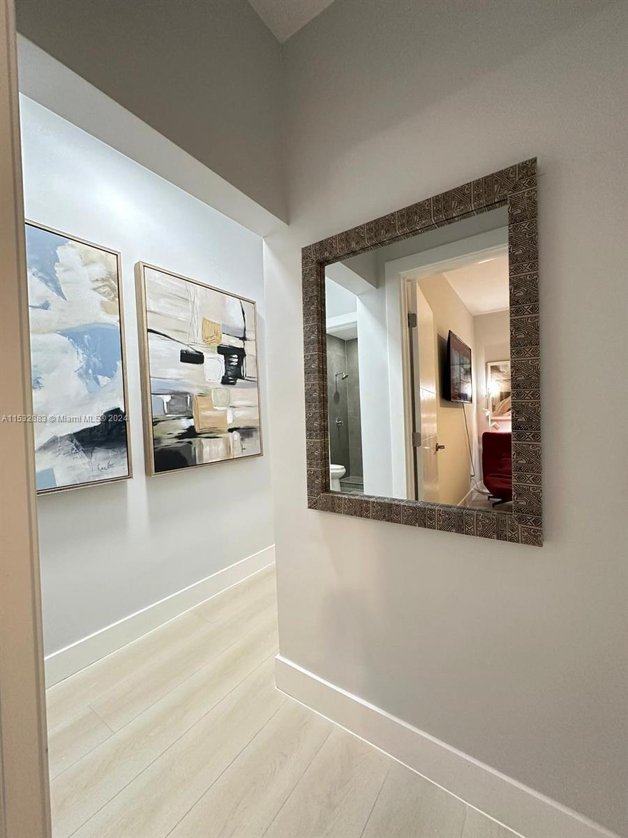 994 Northwest 2nd Street Miami, FL 33128 - Photo 6 of 30 a view of a living room and bathroom