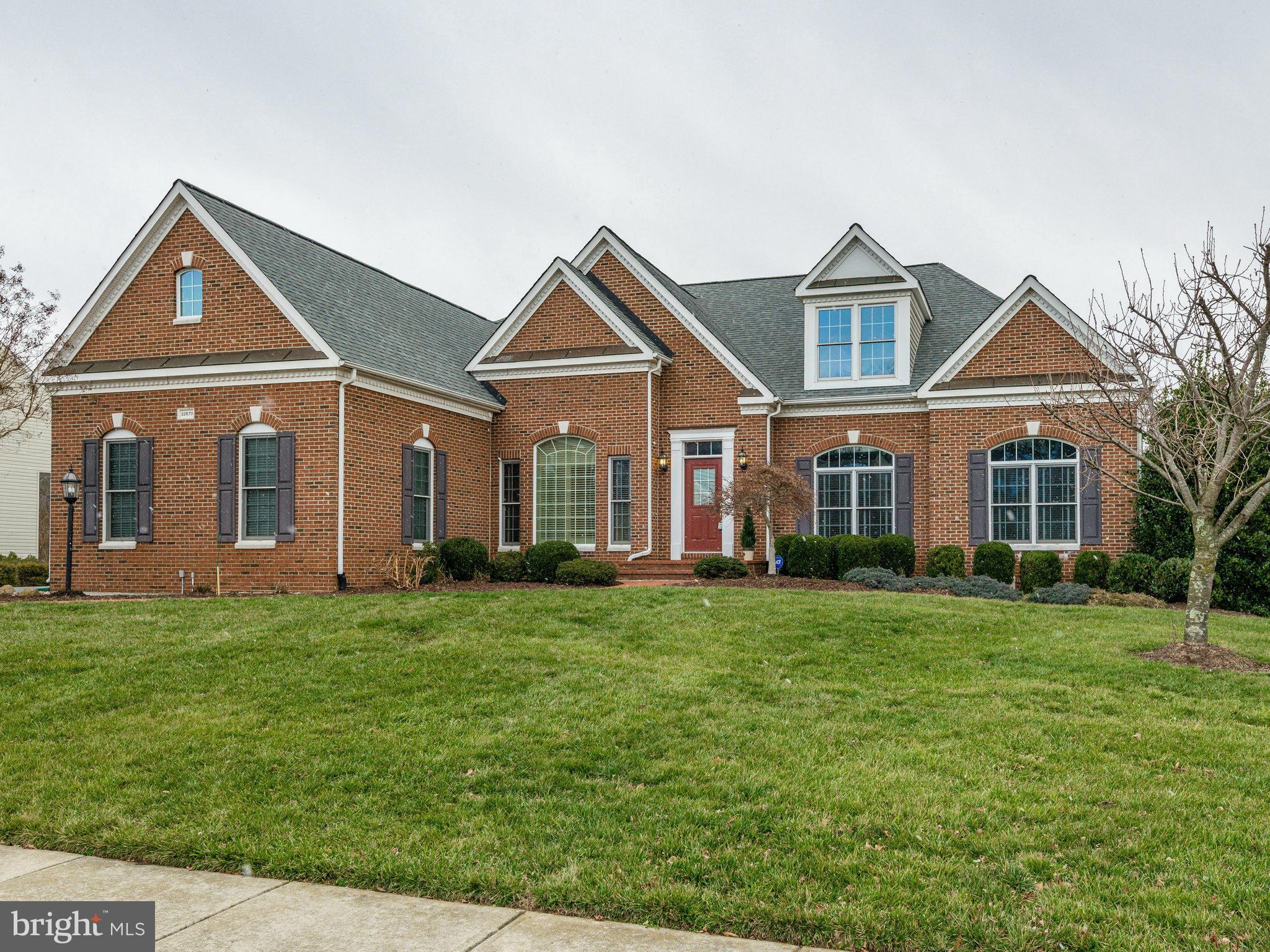 22570 Forest Manor Drive Ashburn, VA 20148 - Photo 1 of 30 a front view of a house with a yard
