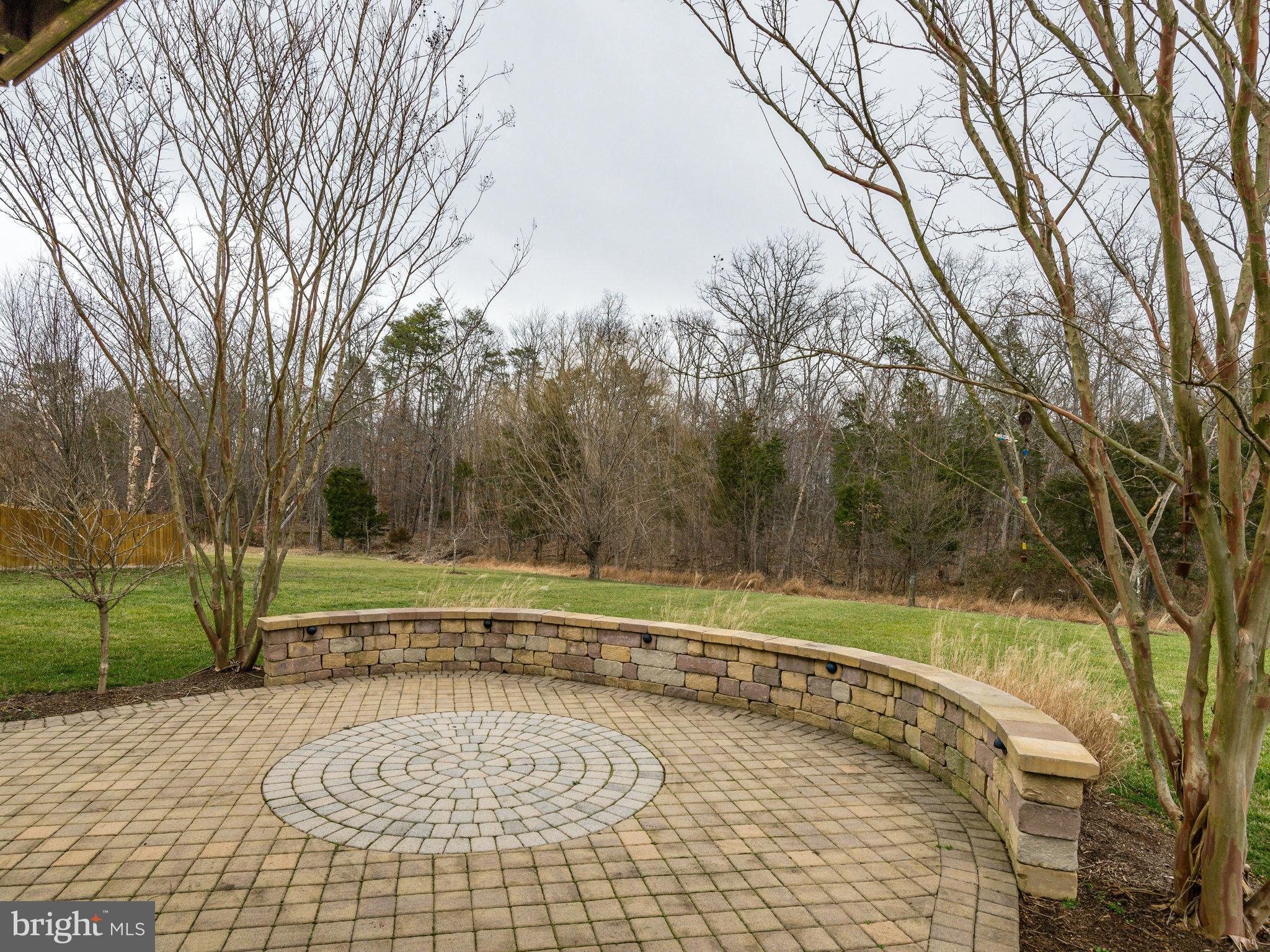 22570 Forest Manor Drive Ashburn, VA 20148 - Photo 28 of 30 a view of a swimming pool with a yard and large trees