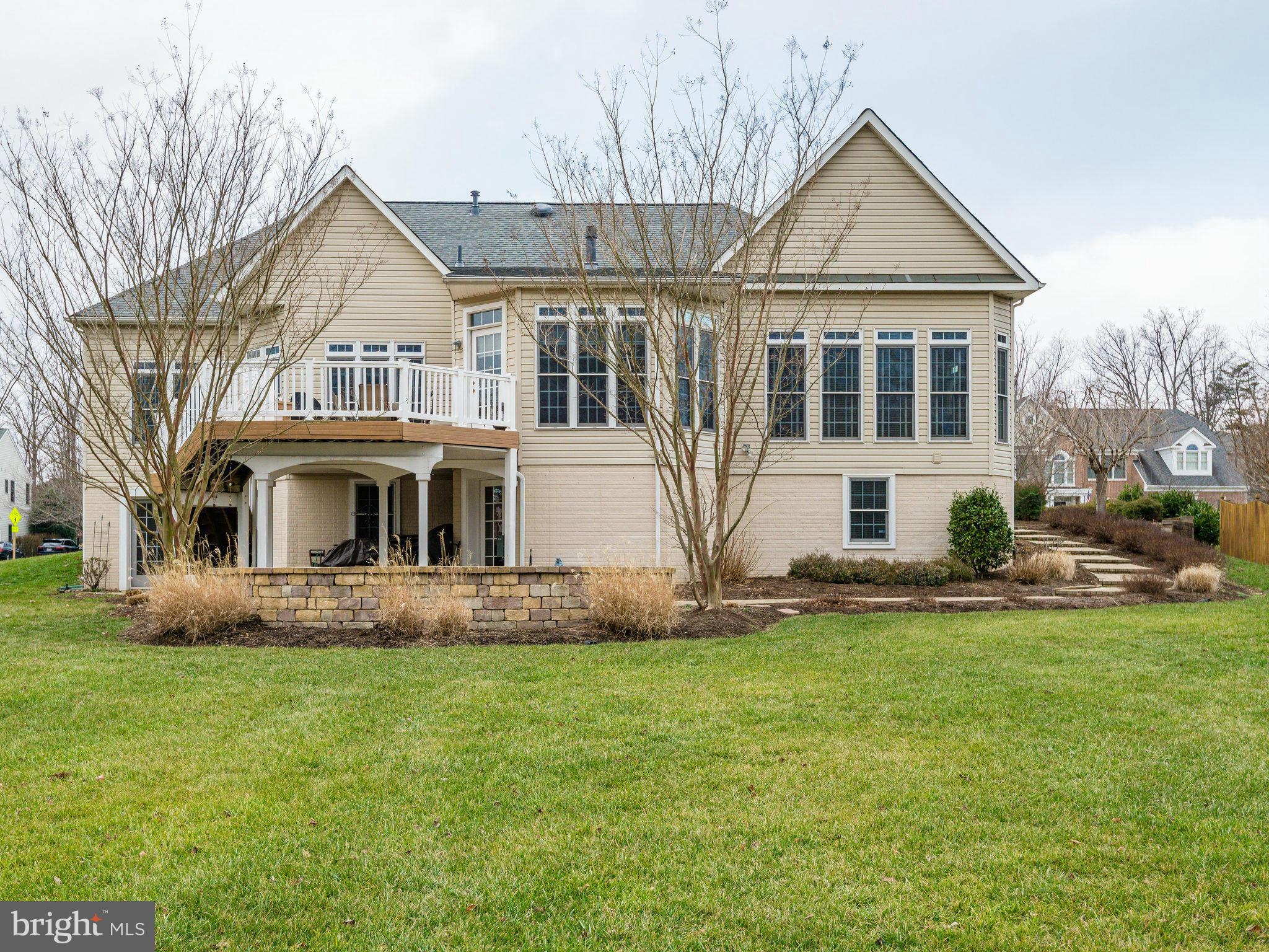 22570 Forest Manor Drive Ashburn, VA 20148 - Photo 30 of 30 a front view of a house with a yard and garden