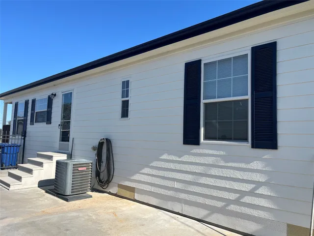 a view of a house with swimming pool and a yard