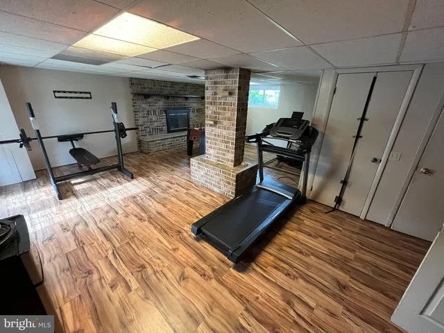 a living room with furniture rug and wooden floor