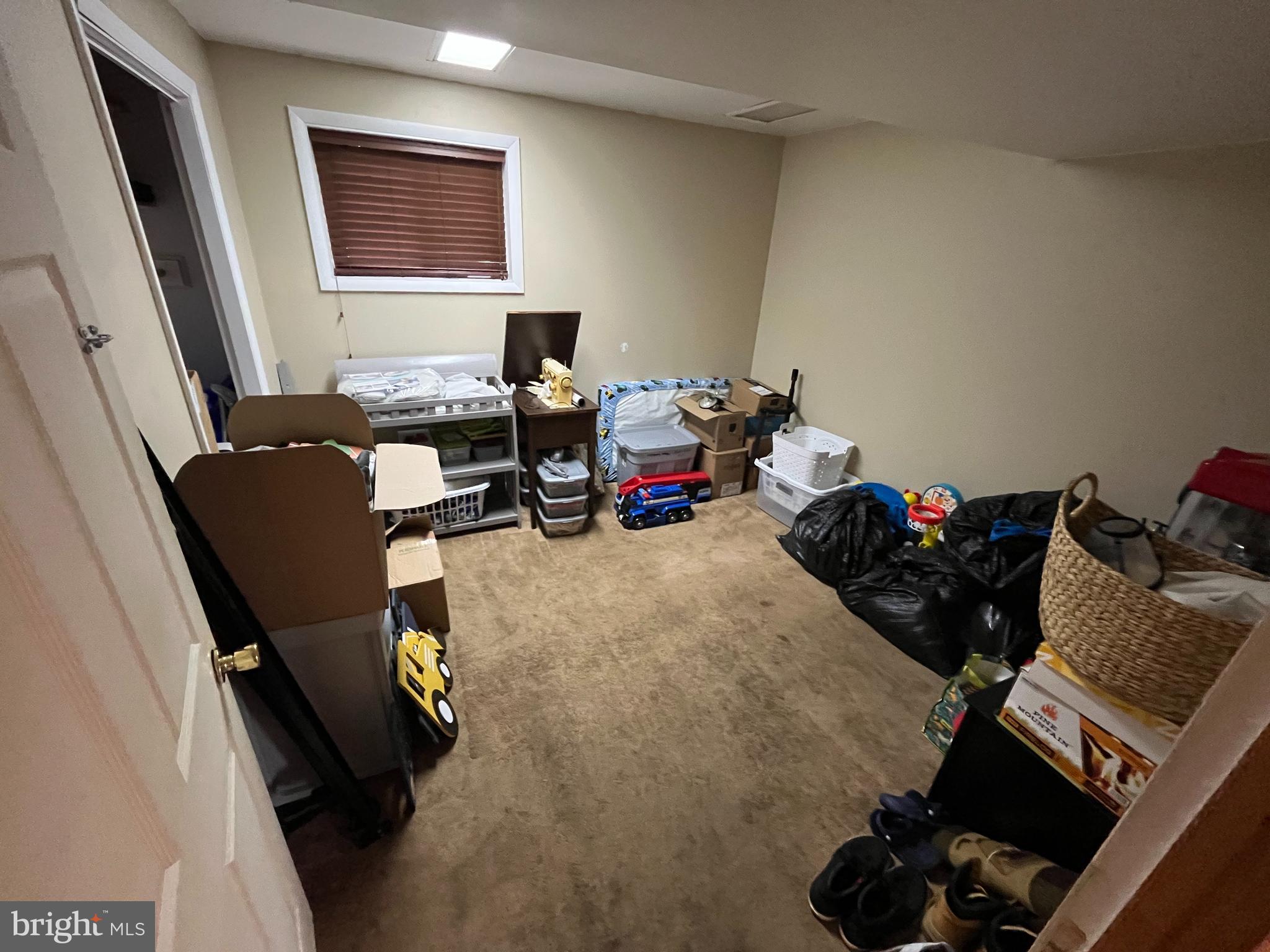 11015 Mexico Farm Road Southeast Cumberland, MD 21502 - Photo 21 of 23 a room with furniture and a window