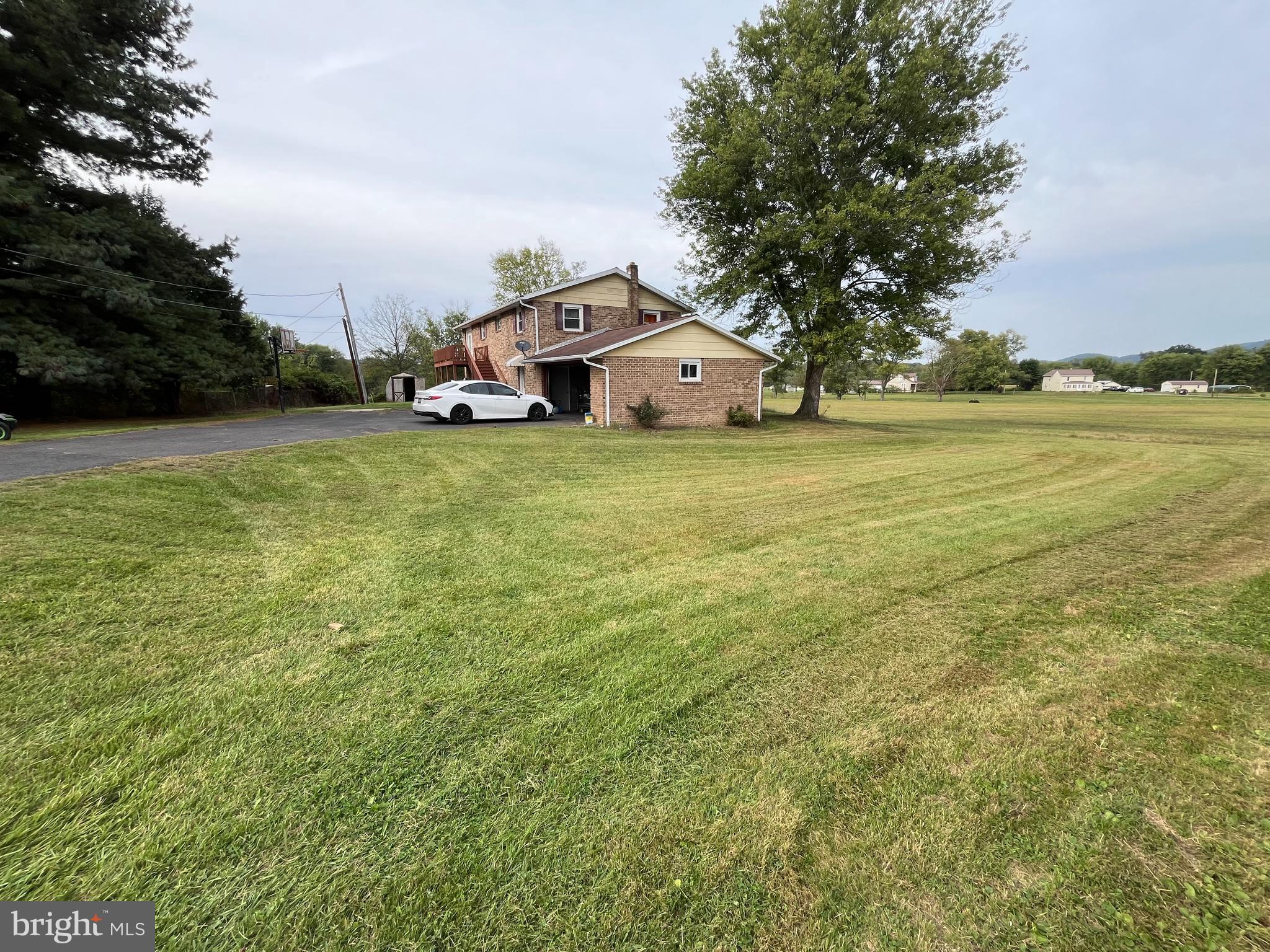 11015 Mexico Farm Road Southeast Cumberland, MD 21502 - Photo 3 of 23 a front view of a house with garden