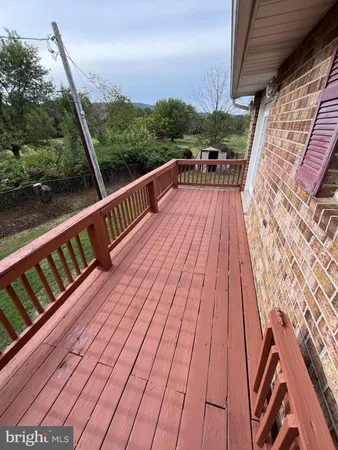 a view of balcony with furniture