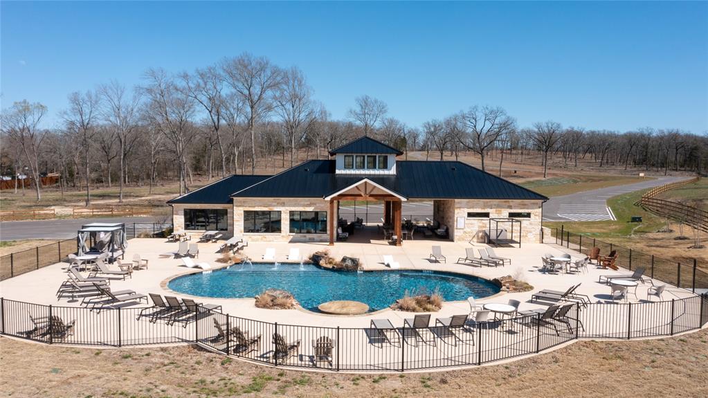 7321 Ranch Oaks Trail Malakoff, TX 75148 - Photo 18 of 21 a patio with a table and chairs under an umbrella