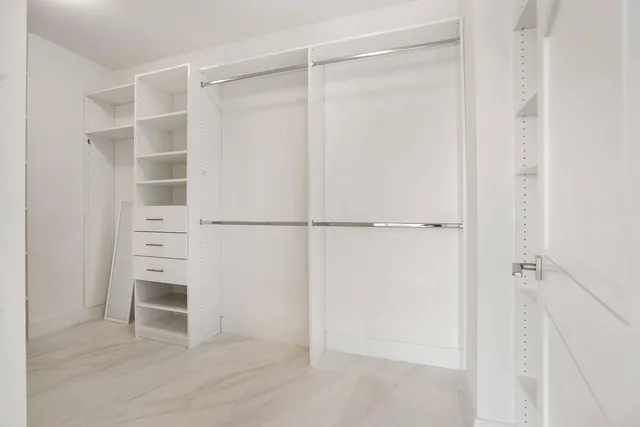 a view of an empty walk in closet