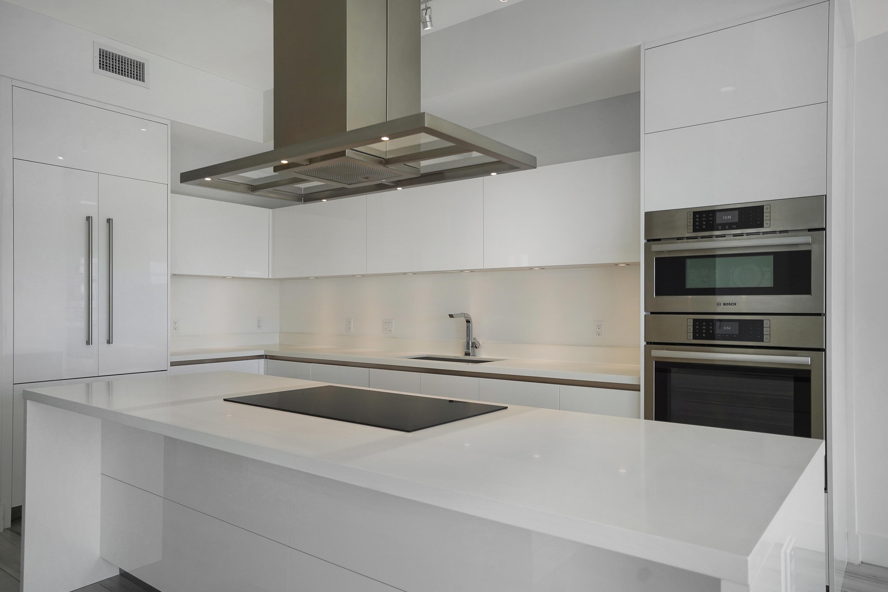 155 East Boca Raton Road, Unit 816 Boca Raton, FL 33432 - Photo 3 of 60 a kitchen with kitchen island a sink and stainless steel appliances