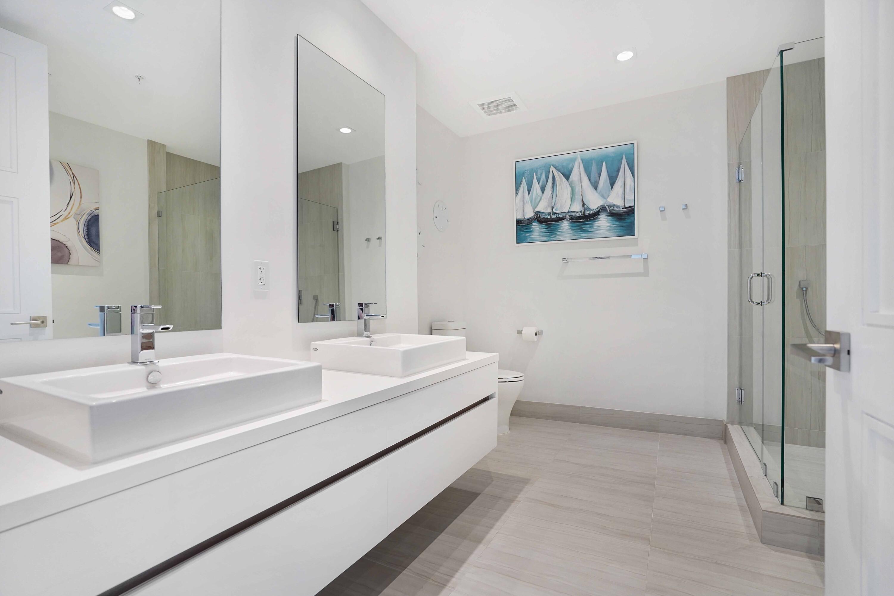 155 East Boca Raton Road, Unit 816 Boca Raton, FL 33432 - Photo 31 of 60 a bathroom with a double vanity sink mirror and double