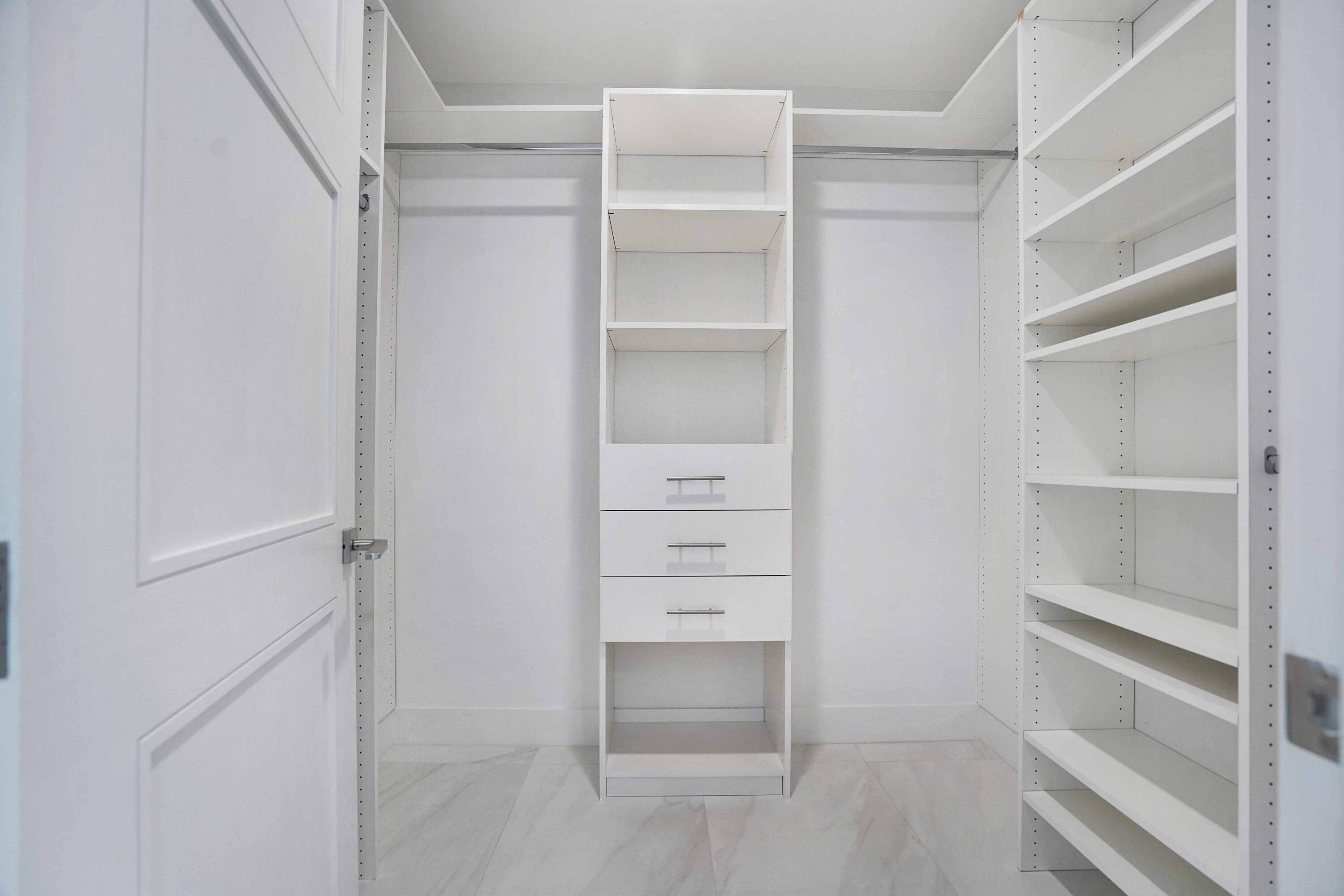155 East Boca Raton Road, Unit 816 Boca Raton, FL 33432 - Photo 34 of 60 a view of an empty walk in closet