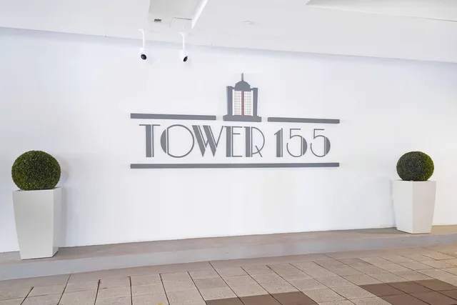a view of backyard with table and chairs under an umbrella