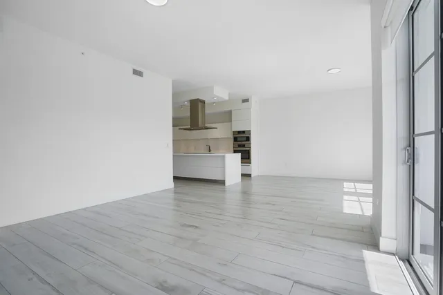 a view of kitchen and wooden floor